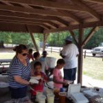 ActioNeters Line Up for Food at the AFDS Summer Picnic
