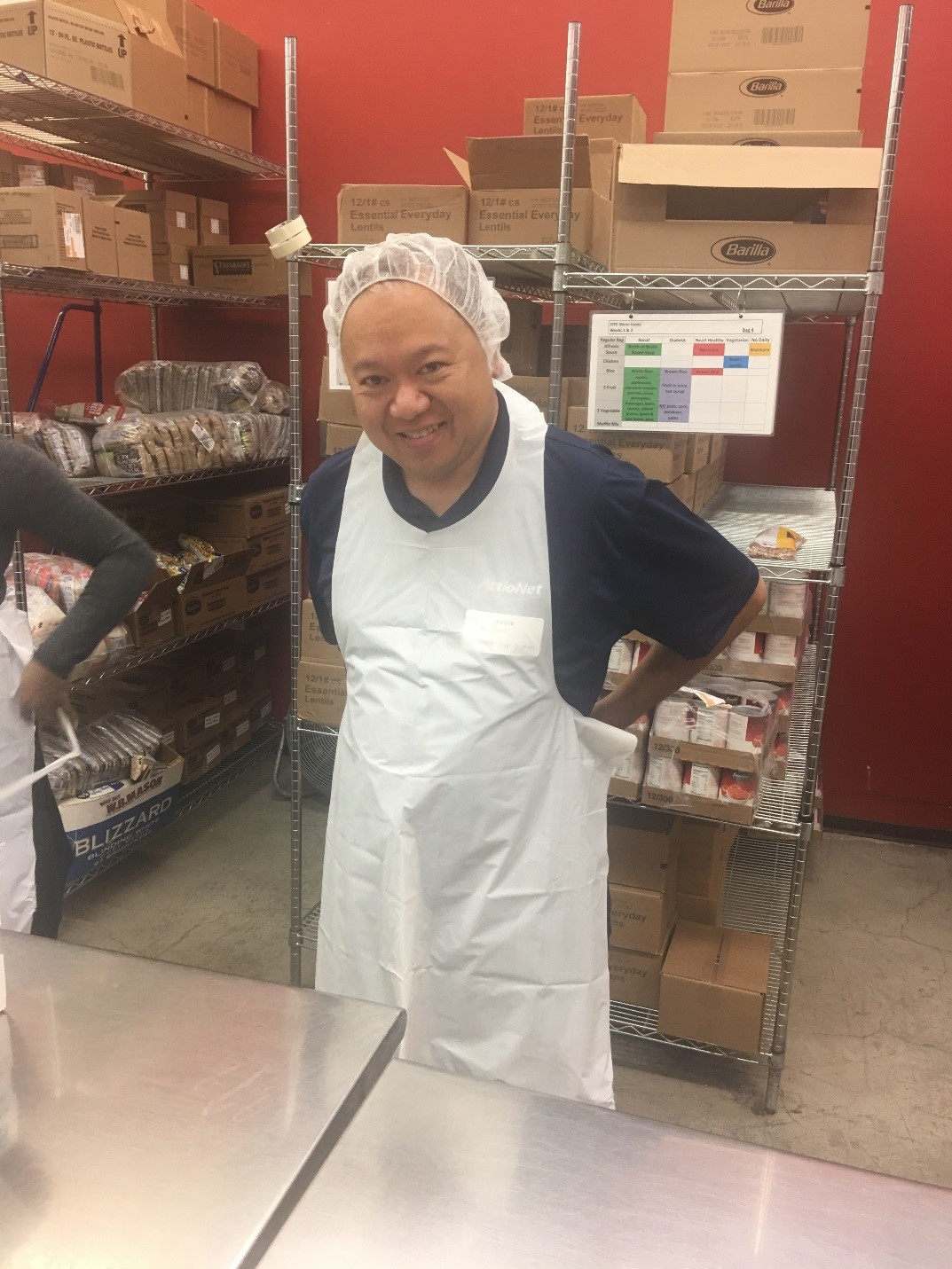 Director Ramon G. putting on his apron before beginning his sorting