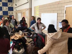 ActioNeters giving Coats to BeWarm Baltimore Attendees