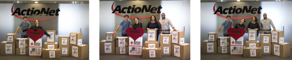 ActioNet employees display clothing donations to American Red Cross