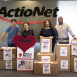 ActioNeters pose with all the boxes of donations for the American Red Cross