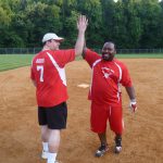 ActioNeters Jeff A. and Tyreace R. High Five on the Softball Field