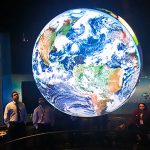 NOAA Team Admires World Globe