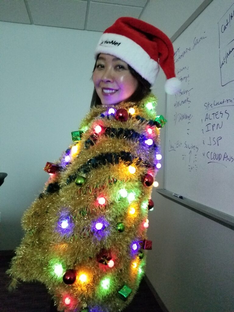 CEO Ashley Trying on the Winning Ugly Sweater