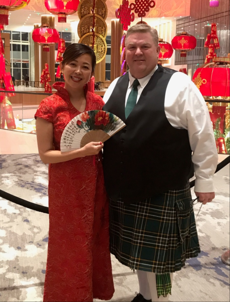 ActioNeter Brandon S. and CEO Ashley C. in their cultural gear for the 2020 winter party