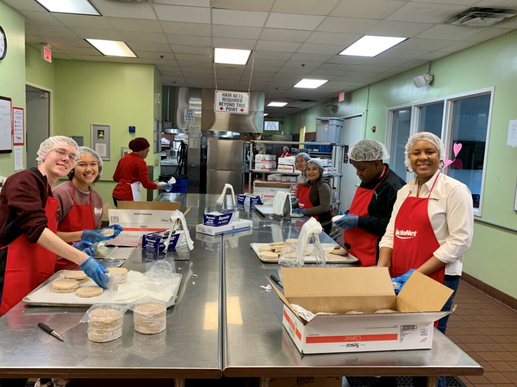 ActioNeters prepare boxes of food for Food & Friends