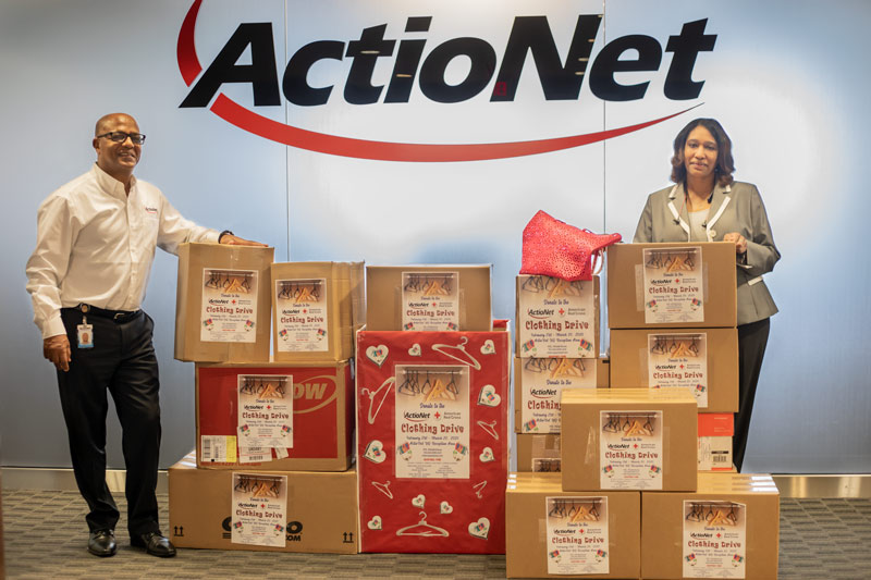 ActioNeters Michelle and Mengie boxed up clothing donations for the American Red Cross