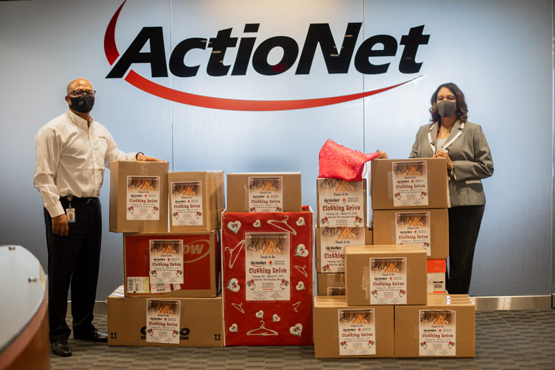 ActioNeters Michelle and Mengie wore masks while boxing clothing donations to the American Red Cross