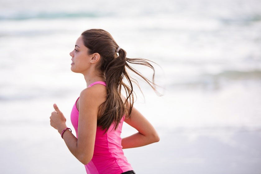 Woman Exercises on beach