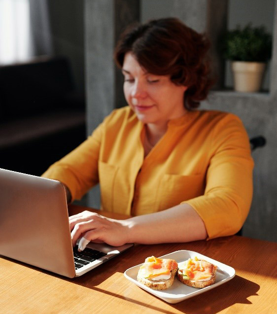 Woman has a healthy high protein snack while working