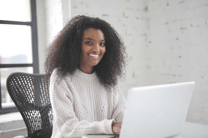 Recruiting team member smiling at the computer